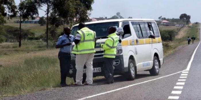 NTSA officials pictured inspecting a matatu on the Nairobi-Nakuru Highway in December 2019